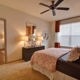 carpeted bedroom with bright window